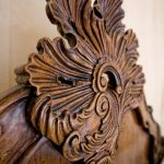 A closeup of ornate wooden carving.