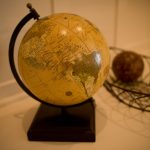 A wooden globe showing North and South America.